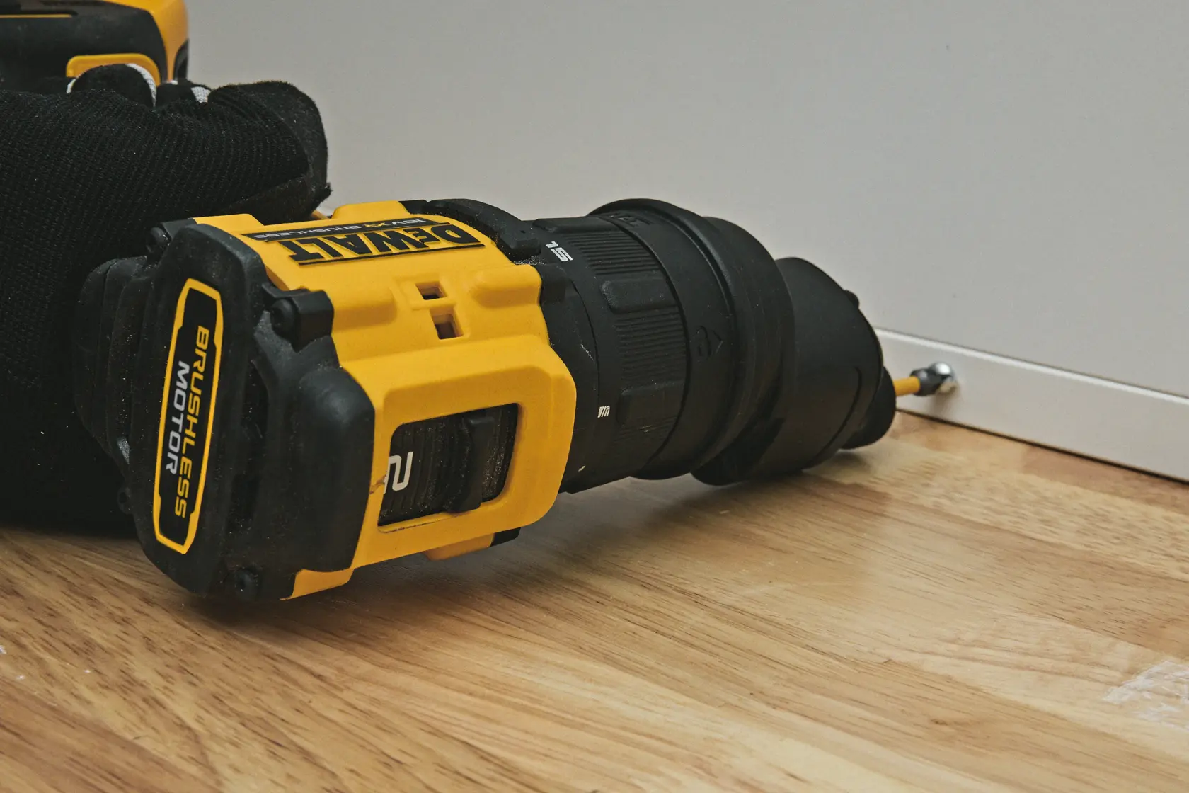 DEWALT DCD803P2T compact drill with 73 Nm torque, shown in use, features a lightweight, ergonomic design.